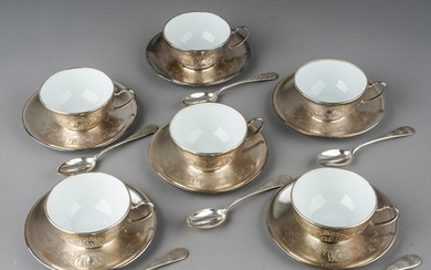 A set of six Continental white metal mounted ceramic coffee ...