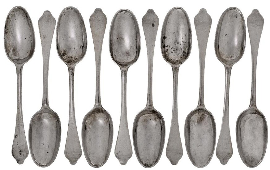 A set of ten Queen Anne silver dog-nose table spoons, London, c.1705, Isaac Davenport, Britannia standard, each with rat-tail bowl and engraved with full coat of arms to reverse of terminal, 20.4cm long, total weight approx. 21.9oz (10) Provenance:...
