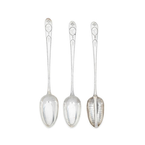 A suite of three Irish silver Celtic Point bright-engraved bottom serving spoons