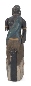 AFRICAN LADY FIGUREHEAD Three-quarter-length woman with a teal blue cloth draped across her chest and a yellow-trimmed skirt. Scroll...
