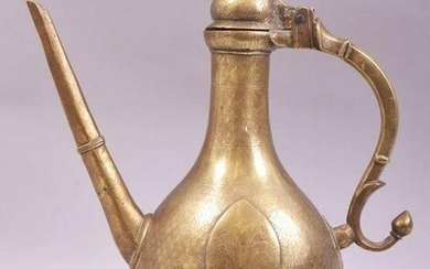 AN 18TH CENTURY MUGHAL BRASS EWER, raised on four brass