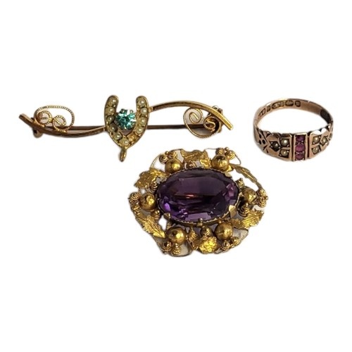 AN EARLY 20TH CENTURY 9CT GOLD, RUBY AND SEED PEARL RING Ha...
