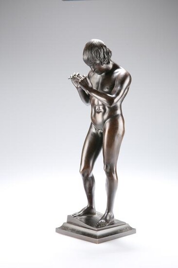 AN EARLY 20TH CENTURY PATINATED BRONZE FIGURE, cast as