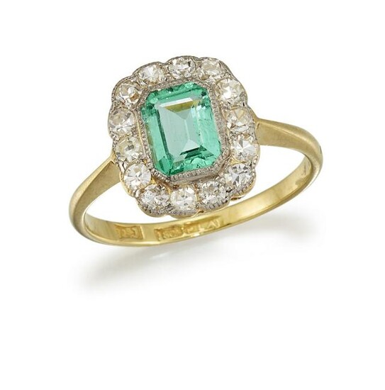 AN EMERALD AND DIAMOND CLUSTER RING The octagonal-cut