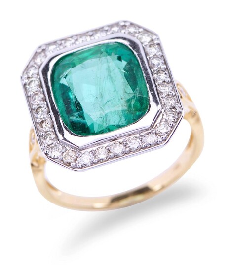 AN EMERALD AND DIAMOND RING - Of cluster design featuring a cushion cut emerald weighing 6.17cts, in a border of round brilliant cut...