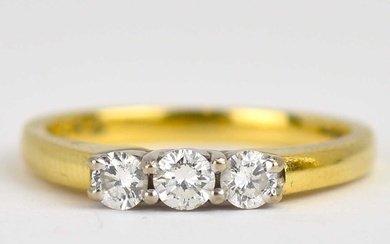 An 18ct gold ring set with three claw set brilliant...