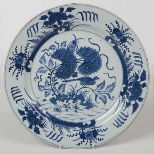 An 18th century Chinese blue and white charger. Painted in u...
