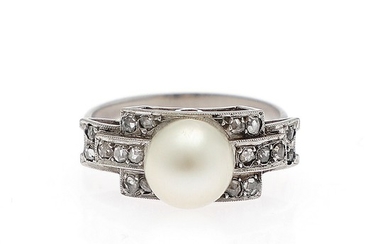 An Art Deco pearl and diamond ring set with a cultured pearl and numerous rose-cut diamonds, mounted in platinum. Size 56. Circa 1930.
