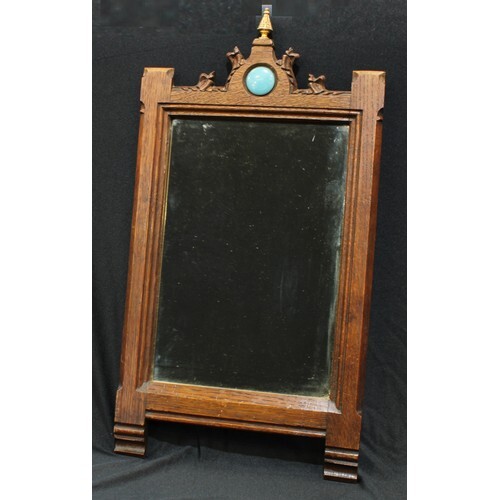 An Arts and Crafts Gothic style mirror, inset with Ruskin pl...