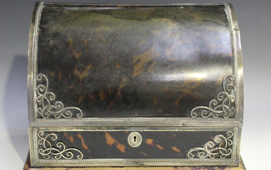 An Edwardian silver mounted, tortoiseshell and leather stationery box, the curved tortoiseshell hing