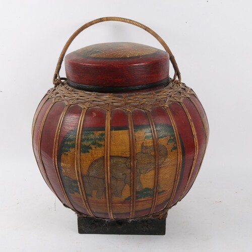 An Oriental lacquered caned and painted food carrying vessel...