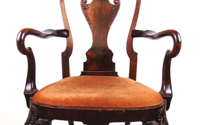 An early 20th century walnut open armchair in the 18th...