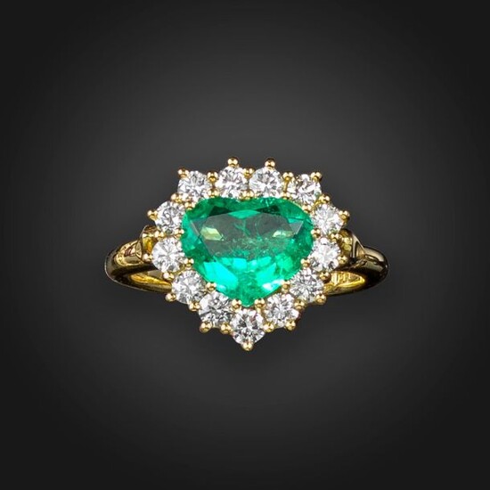 An emerald and diamond heart-shaped cluster ring, the heart-shaped emerald...