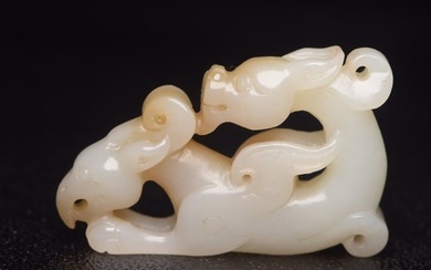 An exquisite white jade pendant with dragon and phoenix patterns