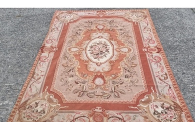 An large Aubusson design Carpet with cream and rust ground. ...