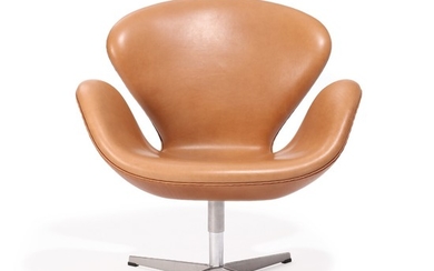 Arne Jacobsen: “The Swan”. Lounge chair upholstered with nougat coloured leather, on lacquered aluminum star base. Manufactured by Fritz Hansen.