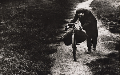 BILL BRANDT (1904-1983) Coal-Searcher Going Home to Jarrow. Silver print, the image measuring...