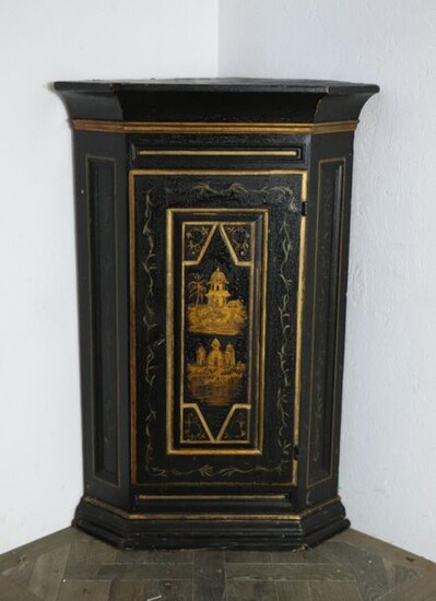 Black and gold lacquered wooden corner cabinet, the front door with far-eastern decor door
