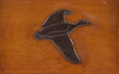 CHARLES HART RELIEF-CARVED FLYING BLACK DUCK PLAQUE Duck under a dark brown stain on a lighter stained plaque. Signed in pencil vers...