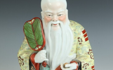 CHINESE POLYCHROME DECORATED PORCELAIN FIGURE OF SEATED ELDER. - H:...