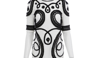 Dolce & Gabbana A white dress with black embroderi and short sleeves,...