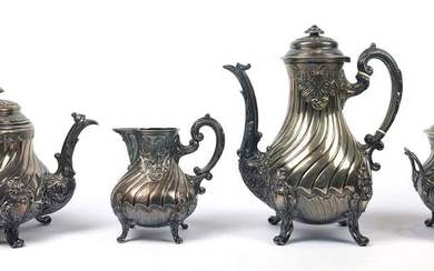 Four-piece tea-coffee service in silver and ivory rings, torso-and-rococo ribbed model decorated with shells and acanthus leaves. The bodies engraved with a monogram. It includes