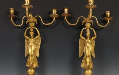 France, a pair of ormolu bronze three-light candles-wandappliques,...