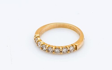 Half an 18-carat (750 thousandths) yellow gold half-ring set with...