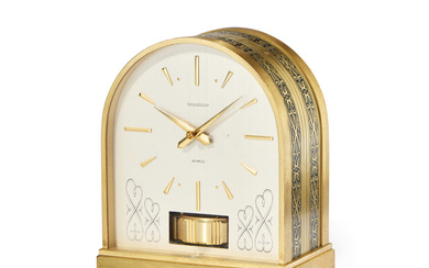 JAEGER-LECOULTRE ATMOS BORNE, 60S Case: gilded brass, decorated with...