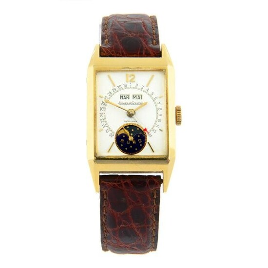 JAEGER-LECOULTRE - a Serie Unique triple calendar moonphase wrist watch. Yellow metal case, stamped