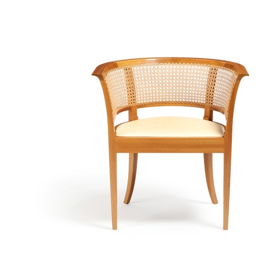 Kaare Klint: “The Faaborg Chair”. Armchair with mahogany frame with woven cane. Seat upholstered with natural leather. Rud. Rasmussens snedkerier.