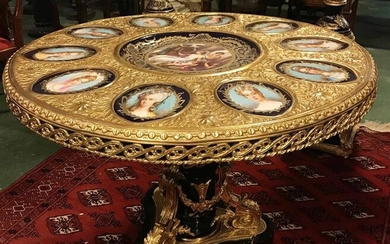 Napoleon lll gilt bronze mounted Ebonized wood with Sevres Style porcelain mounted center table