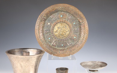 Near Eastern, a collection of four metal-silver alloy objects and a Tibetan metal plate with turkois inlay.