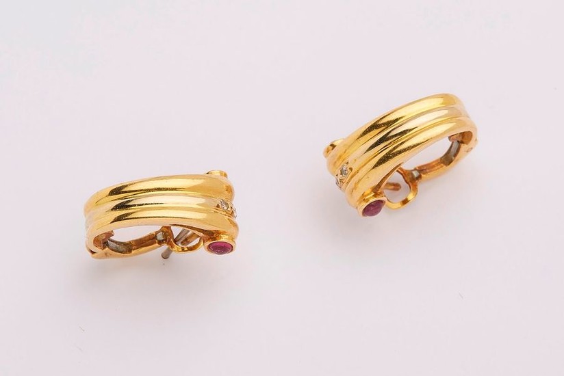Pair of Art-deco style yellow gold earrings decorated...