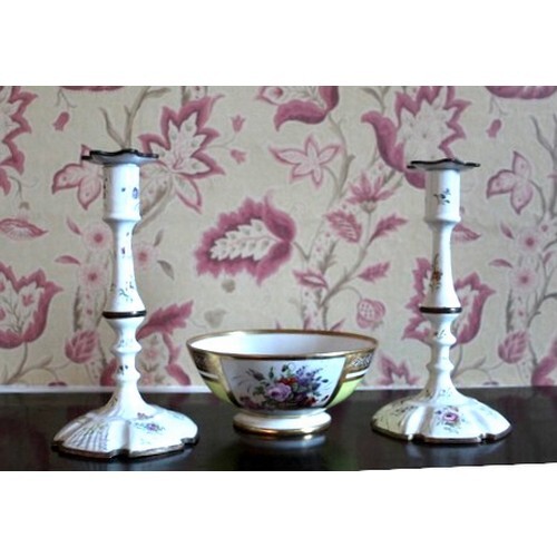 Pair of Staffordshire type enamel candlesticks, decorated wi...