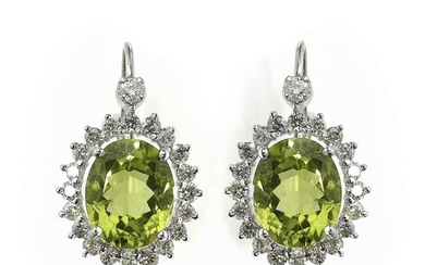 Pair of peridot, diamond, and 14k ear pendants