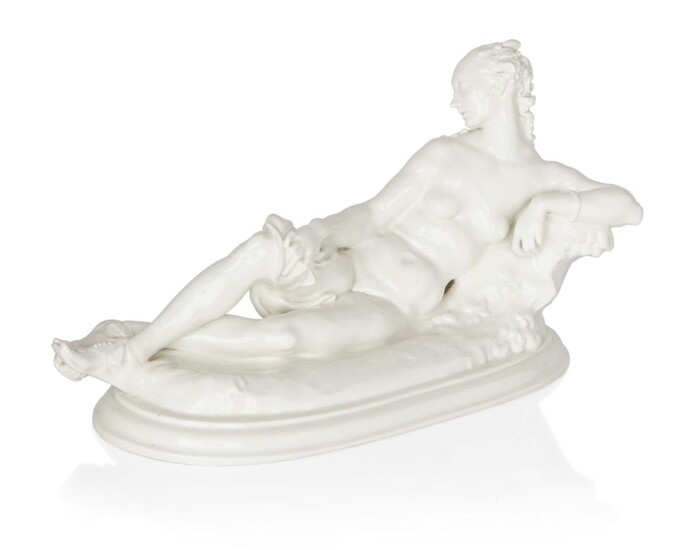 Paul Scheurich (1883-1945) for KPM Berlin, Model of Daphne reclining against a rock, model no. 11031, designed 1918, Glazed porcelain, Underside with blue sceptre mark, 23cm high, 38cm diameter Footnote A similar example is held at The British...