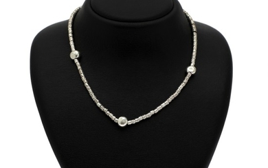 Pomellato: A “Dodo” necklace set with numerous beads and three spaces of sterling silver. W. app. 34 g. L. 46 cm.