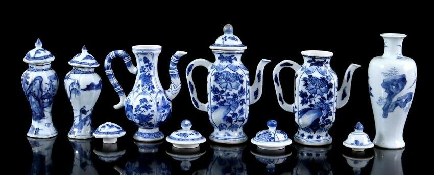 Porcelain miniature jugs, lidded pots and loose lids