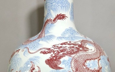 Qing Dynasty Yongzheng blue and white seawater underglaze red dragon pattern celestial globe vase