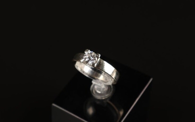 RING in white gold set with a diamond of about...