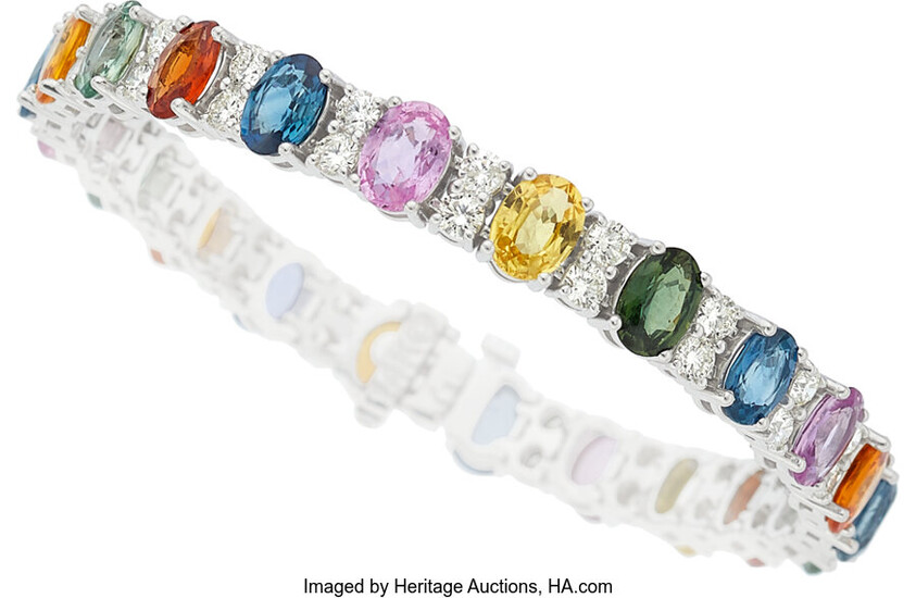 Sapphire, Diamond, White Gold Bracelet Stones: Oval-shaped multi-color sapphires...