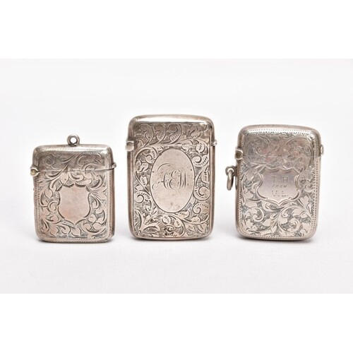 THREE LATE VICTORIAN SILVER VESTAS, each with an engraved fo...