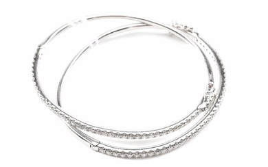 TWO CHILDREN'S DIAMOND SET BANGLES TOTALLING 3.20CTS, IN 18CT WHITE GOLD, INNER DIMENSIONS 50MM X 45MM