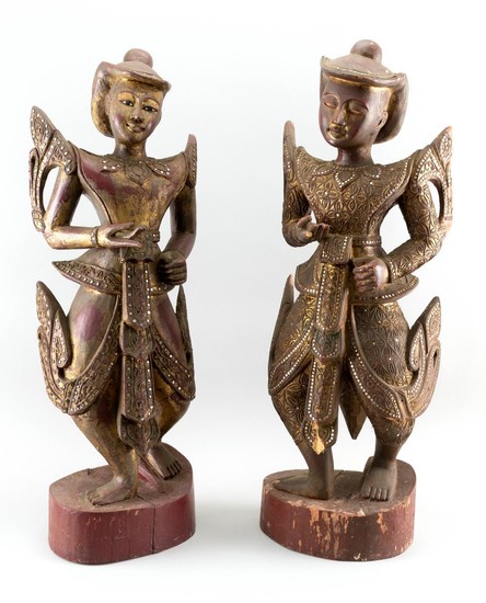 TWO THAI GILT AND LACQUERED CARVED WOOD FIGURES OF DANCERS A male and female, both with mirrored embellishments, standing on wooden...