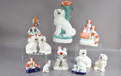 Thirteen various Staffordshire style dogs