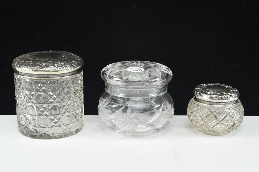 Trio of lidded crystal condiment jars including William