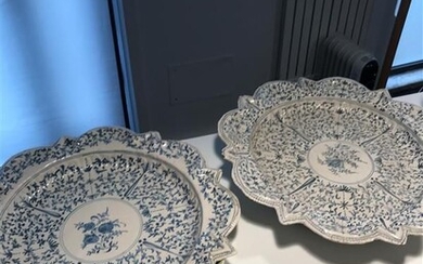 Two large dishes with radiant blue decoration of plants and central cartouche with floral design. Italy 18th century