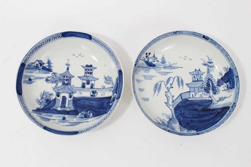 Two similar Lowestoft blue and white saucers, c.1790, painted with Oriental pagoda patterns, ex. Kitty Brumpton collection