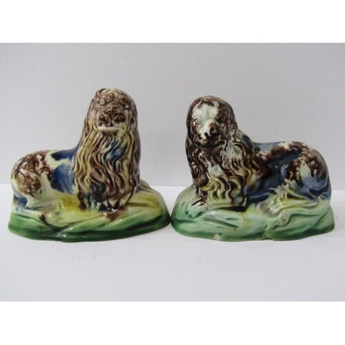 WHIELDON-TYPE LIONS, pair of slip glazed pottery resting lio...